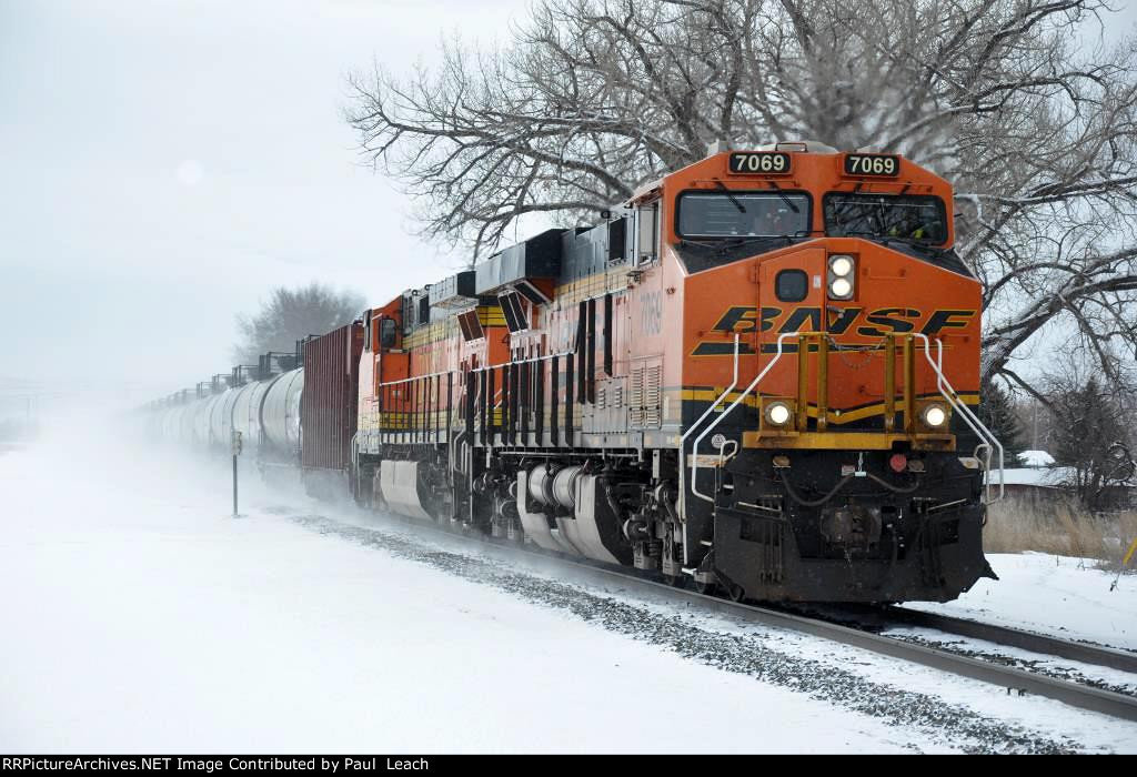 Westbound tanker train kicks up the snow